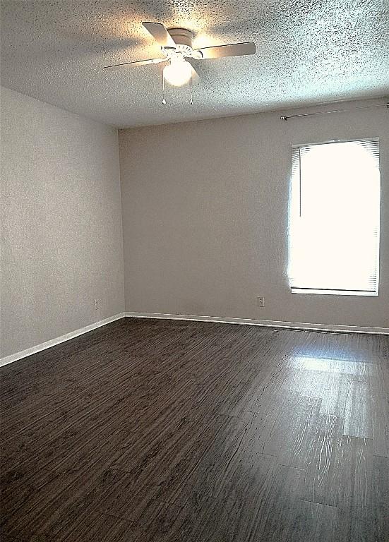 910 Duncan Ln Unit 27, Austin, TX 78705 - empty room featuring a ceiling fan, wood finished floors, and a textured ceiling