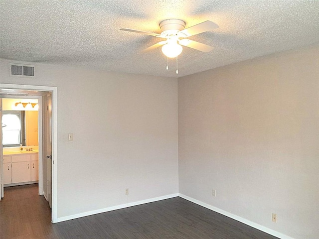 910 Duncan Ln Unit 27, Austin, TX 78705 - empty room with dark wood finished floors, a ceiling fan, and a textured ceiling
