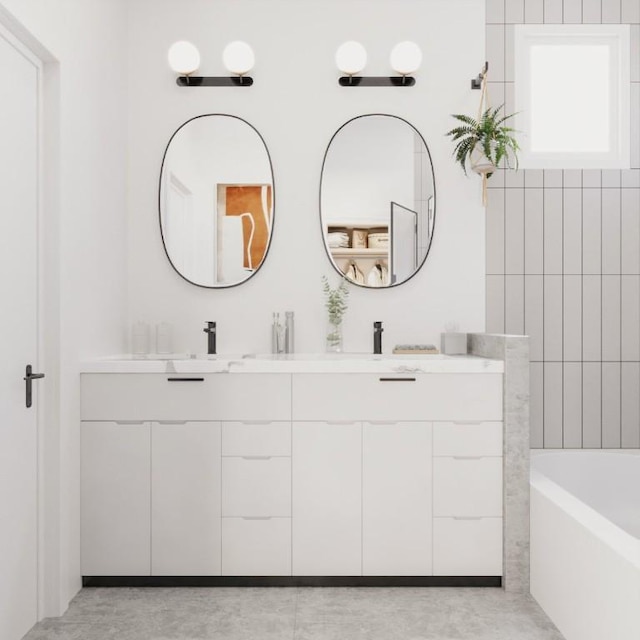 bathroom with double vanity, a washtub, and a sink