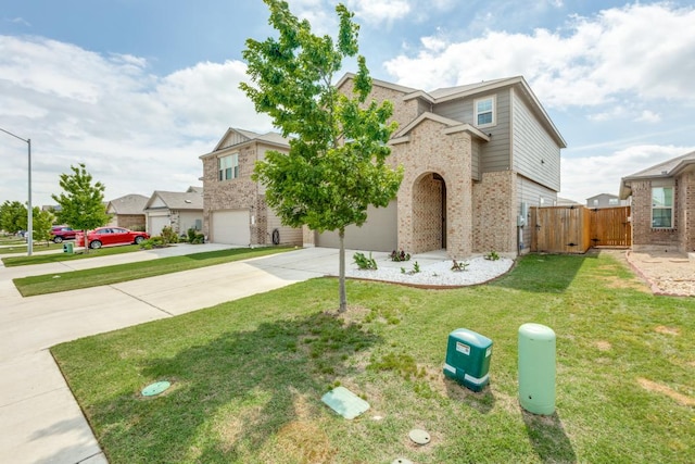 532 Greatest Gift Way, Jarrell, TX 76537 - traditional-style home with concrete driveway, brick siding, a garage, and a gate