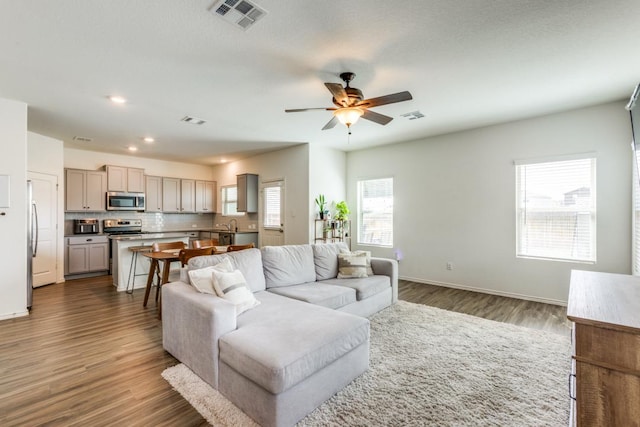 532 Greatest Gift Way, Jarrell, TX 76537 - living area with a ceiling fan, wood finished floors, baseboards, and recessed lighting