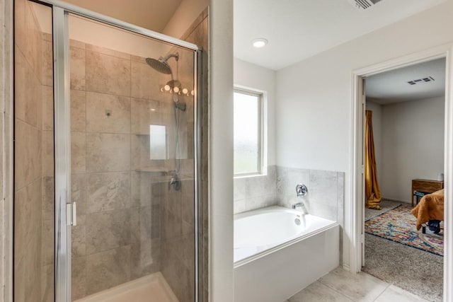 ensuite bathroom with tile patterned floors, visible vents, a garden tub, a stall shower, and ensuite bathroom