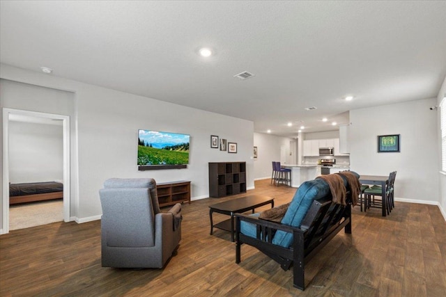 609 Bluffview Dr, Bastrop, TX 78602 - living room featuring recessed lighting and dark wood-style flooring
