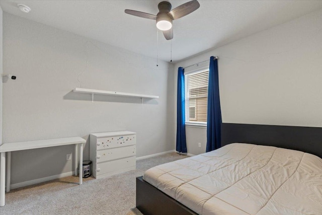 609 Bluffview Dr, Bastrop, TX 78602 - carpeted bedroom with baseboards and ceiling fan