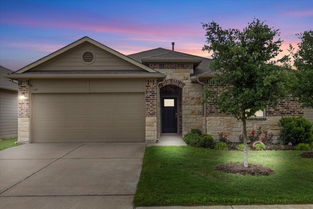 609 Bluffview Dr, Bastrop, TX 78602 - view of front facade with stone siding, driveway, a garage, a front lawn, and roof with shingles