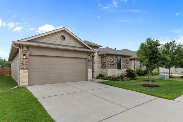 609 Bluffview Dr, Bastrop, TX 78602 - ranch-style home featuring a garage, driveway, brick siding, and stone siding