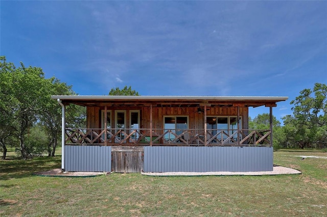 back of property with a yard