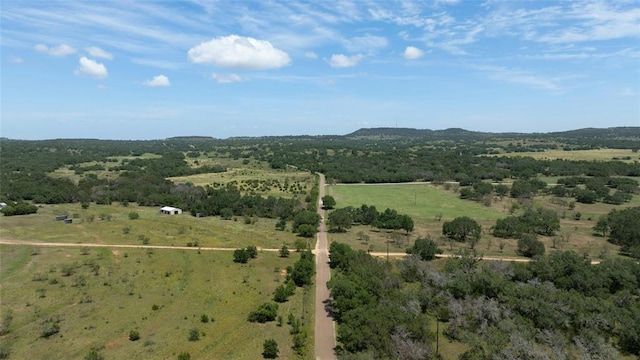 birds eye view of property featuring a rural view