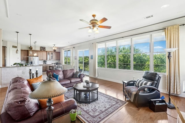 1204 Ogden Dr, Austin, TX 78733 - living room featuring ceiling fan and wood finished floors