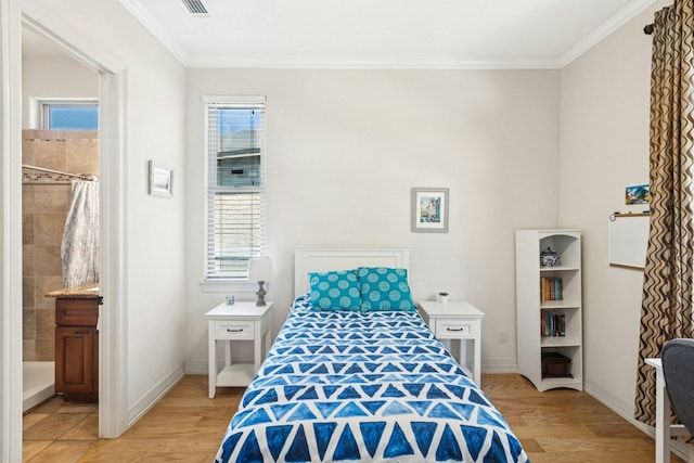 1204 Ogden Dr, Austin, TX 78733 - bedroom with light wood finished floors, crown molding, and connected bathroom