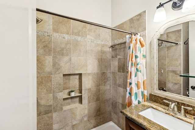 1204 Ogden Dr, Austin, TX 78733 - bathroom featuring vanity and tiled shower