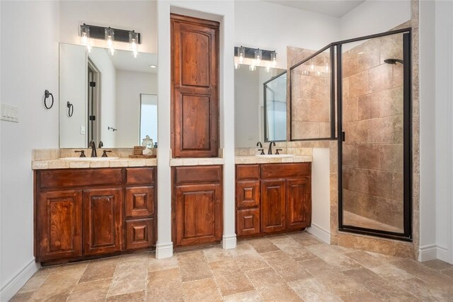 15 Chandon Ln, Lakeway, TX 78734 - full bath featuring a stall shower, two vanities, and stone finish flooring