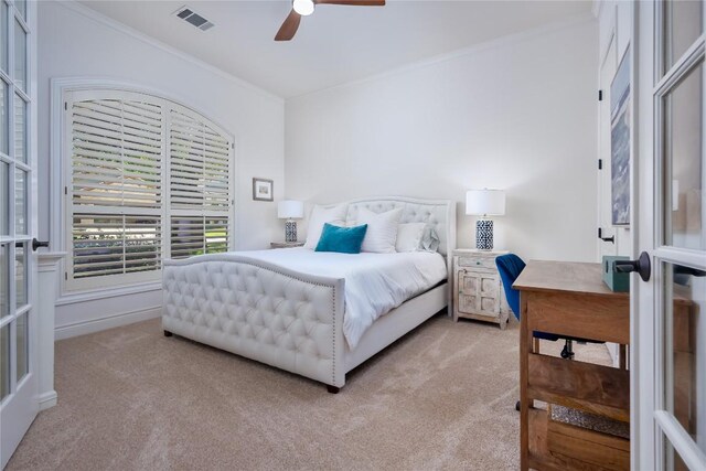 15 Chandon Ln, Lakeway, TX 78734 - bedroom with light colored carpet, crown molding, and ceiling fan