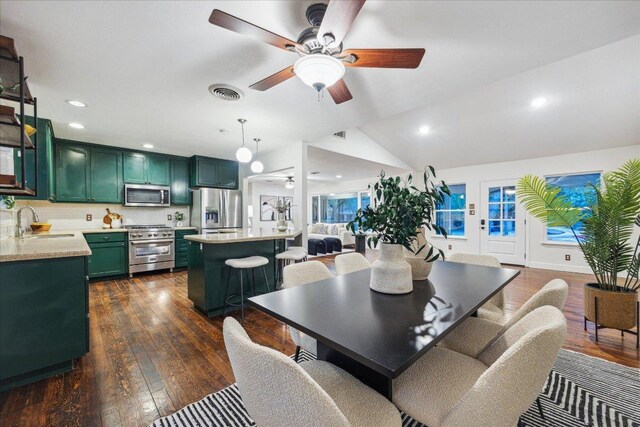 dining space with dark wood finished floors, visible vents, recessed lighting, lofted ceiling, and ceiling fan