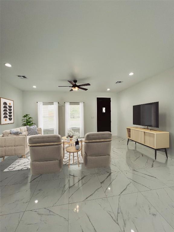living area with a ceiling fan, visible vents, recessed lighting, and marble finish floor