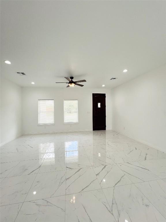 unfurnished room featuring recessed lighting, marble finish floor, visible vents, baseboards, and ceiling fan