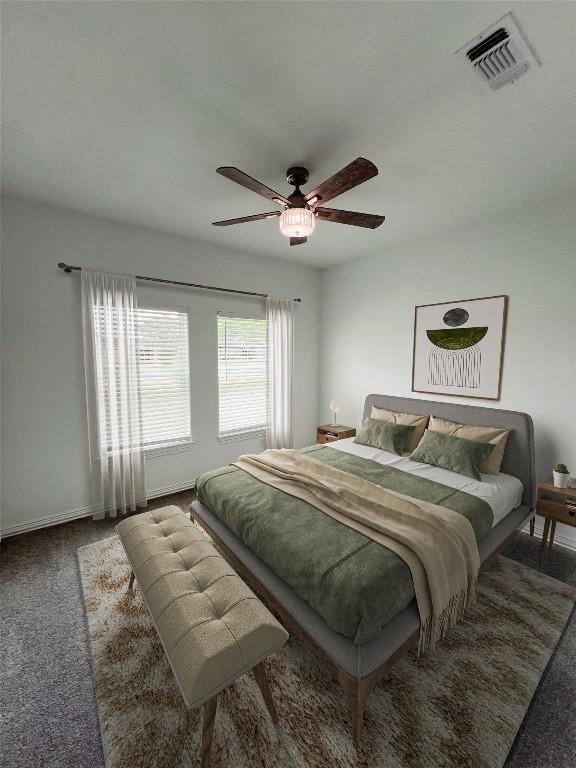 carpeted bedroom featuring ceiling fan and visible vents
