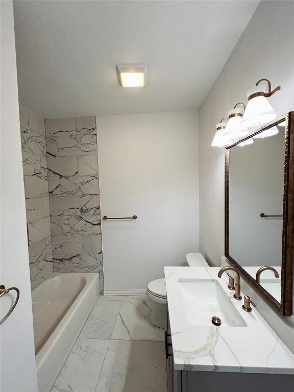 full bath with marble finish floor, vanity, and toilet
