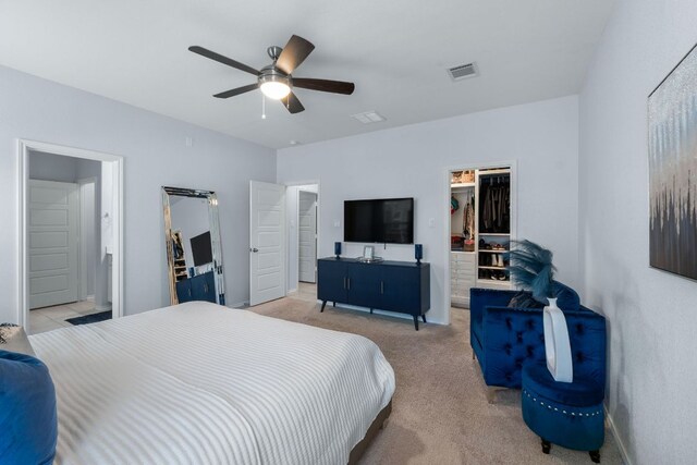 245 Six Shooter Dr, Kyle, TX 78640 - bedroom with a spacious closet, a closet, carpet floors, and ceiling fan