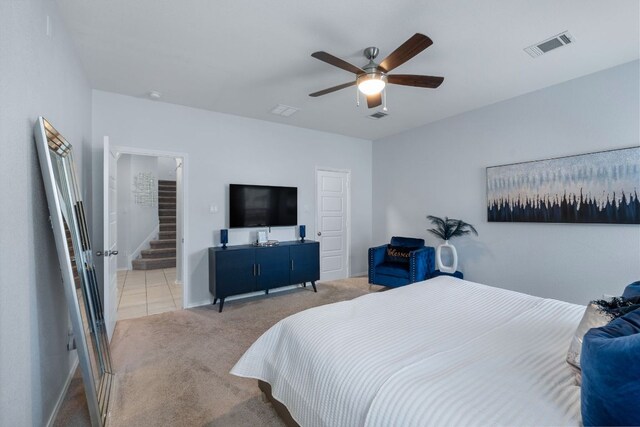 245 Six Shooter Dr, Kyle, TX 78640 - bedroom featuring light carpet and ceiling fan