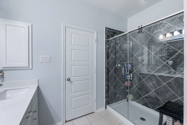 245 Six Shooter Dr, Kyle, TX 78640 - full bathroom featuring vanity, a shower stall, and tile patterned floors