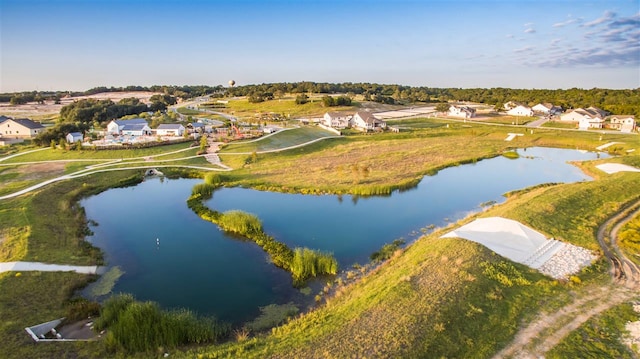 bird's eye view with a residential view and a water view