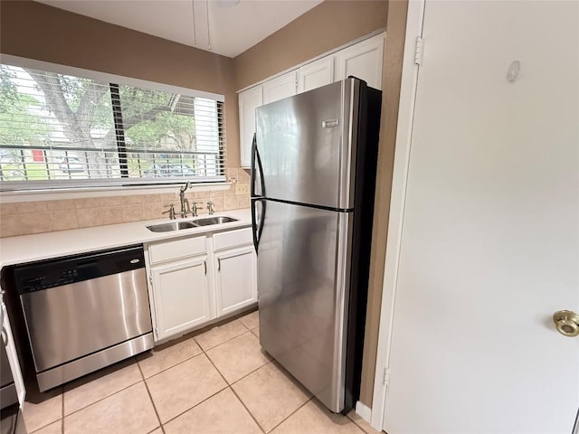 8142 Ceberry Dr Unit B, Austin, TX 78759 - kitchen featuring appliances with stainless steel finishes, a sink, white cabinets, and light countertops