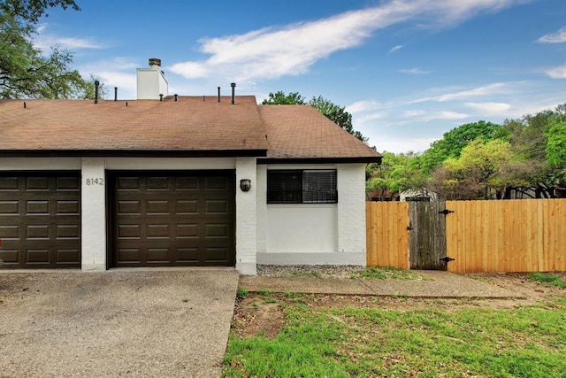 8142 Ceberry Dr Unit B, Austin, TX 78759 - garage featuring driveway and a gate