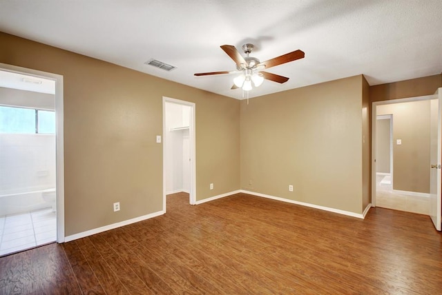 8142 Ceberry Dr Unit B, Austin, TX 78759 - spare room featuring ceiling fan, dark wood-style flooring, and baseboards