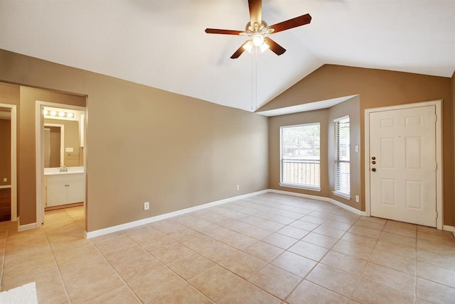 8142 Ceberry Dr Unit B, Austin, TX 78759 - foyer featuring light tile patterned floors, ceiling fan, vaulted ceiling, and baseboards