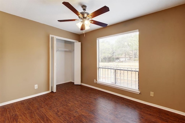 8142 Ceberry Dr Unit B, Austin, TX 78759 - unfurnished bedroom with wood finished floors, a closet, baseboards, and a ceiling fan