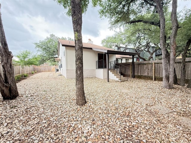 8142 Ceberry Dr Unit B, Austin, TX 78759 - rear view of property with a fenced backyard and a chimney