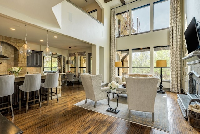 2104 University Club Dr, Austin, TX 78732 - living area with dark wood-style floors, a towering ceiling, and recessed lighting