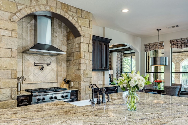 2104 University Club Dr, Austin, TX 78732 - kitchen featuring wall chimney exhaust hood, a sink, and light stone countertops