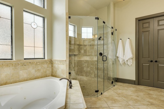 2104 University Club Dr, Austin, TX 78732 - bathroom featuring a whirlpool tub, a shower stall, and tile patterned flooring