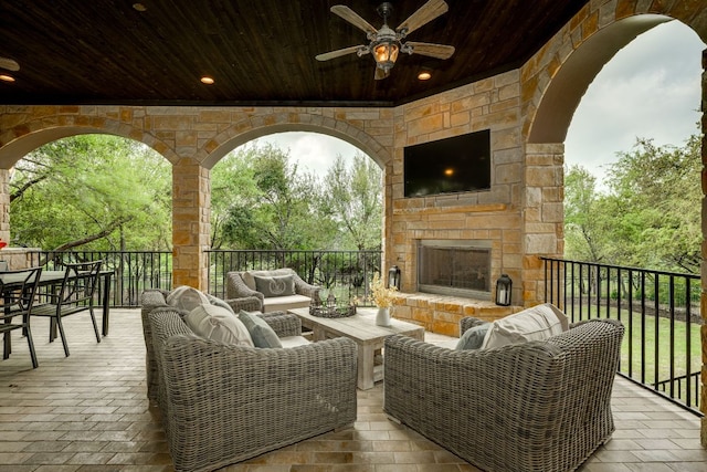 2104 University Club Dr, Austin, TX 78732 - view of patio / terrace with an outdoor living space with a fireplace and a ceiling fan