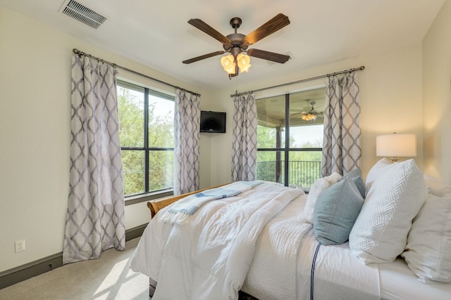 2104 University Club Dr, Austin, TX 78732 - bedroom featuring access to outside, multiple windows, carpet flooring, and baseboards