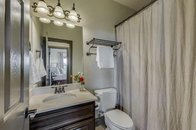 2104 University Club Dr, Austin, TX 78732 - bathroom featuring toilet, vanity, a textured wall, and a shower with curtain