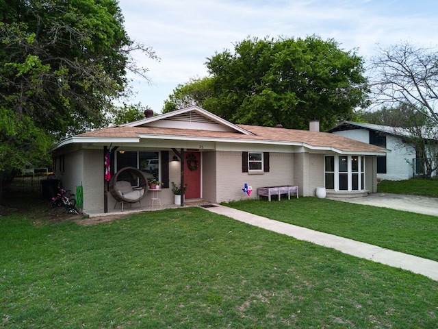 26 N Castleberry St, Lampasas, TX 76550 - single story home with brick siding, a chimney, and a front yard