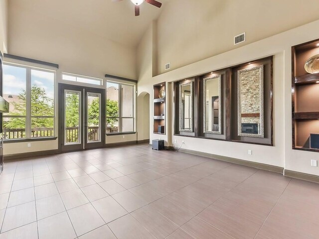 6120 Gunnison Turn Rd, Austin, TX 78738 - unfurnished sunroom featuring arched walkways and vaulted ceiling
