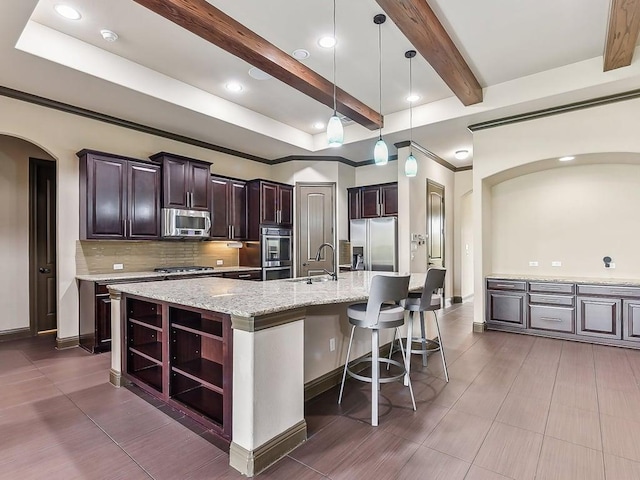 6120 Gunnison Turn Rd, Austin, TX 78738 - kitchen featuring appliances with stainless steel finishes, open shelves, beamed ceiling, a sink, and arched walkways