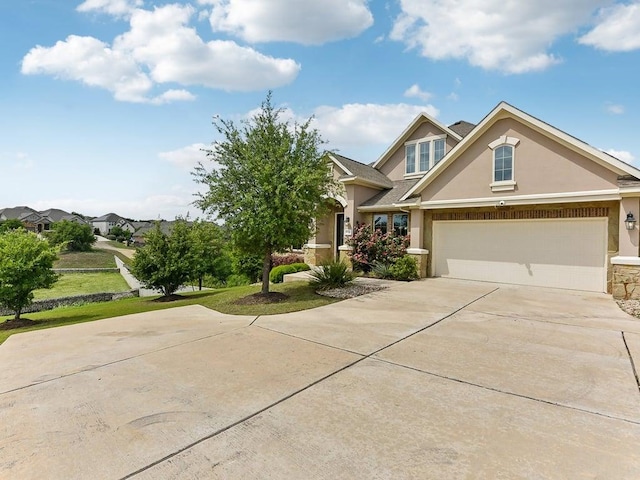 6120 Gunnison Turn Rd, Austin, TX 78738 - view of front of property featuring stucco siding, driveway, stone siding, a front lawn, and an attached garage