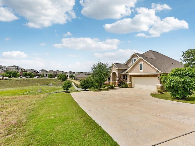 6120 Gunnison Turn Rd, Austin, TX 78738 - view of front of property featuring stucco siding, driveway, a front yard, a residential view, and a garage