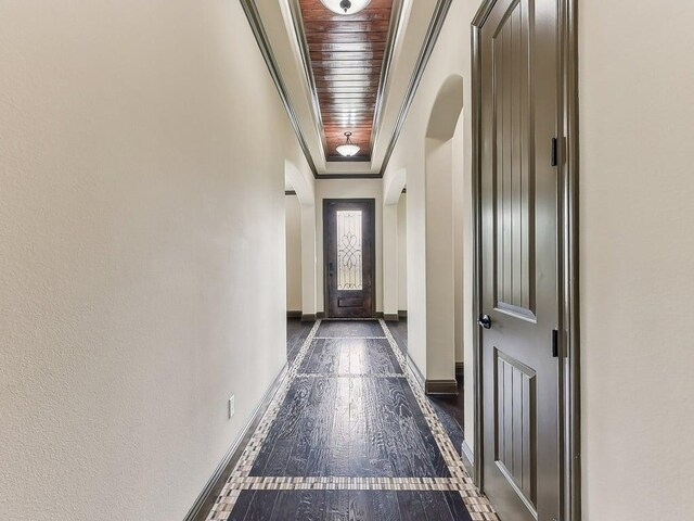 6120 Gunnison Turn Rd, Austin, TX 78738 - doorway to outside with arched walkways, baseboards, wood ceiling, and dark wood finished floors