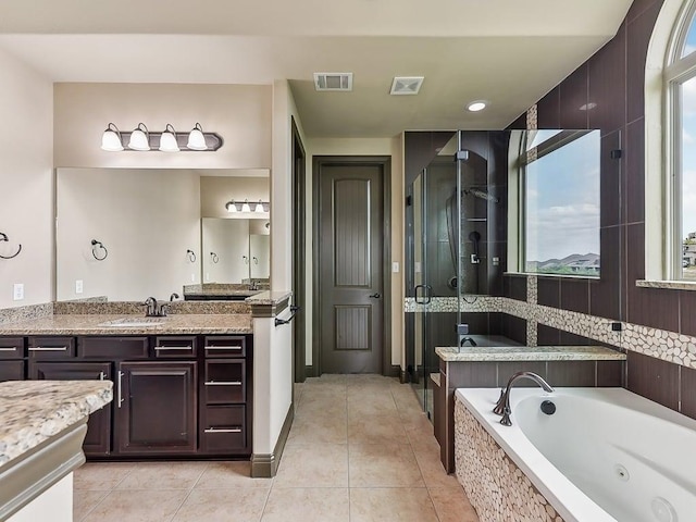 6120 Gunnison Turn Rd, Austin, TX 78738 - full bath featuring a whirlpool tub, a stall shower, tile patterned flooring, and vanity