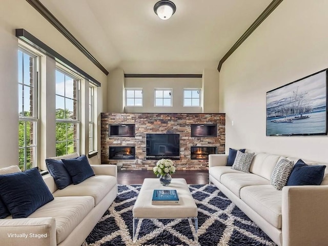 6120 Gunnison Turn Rd, Austin, TX 78738 - living area featuring a fireplace, wood finished floors, vaulted ceiling, and crown molding