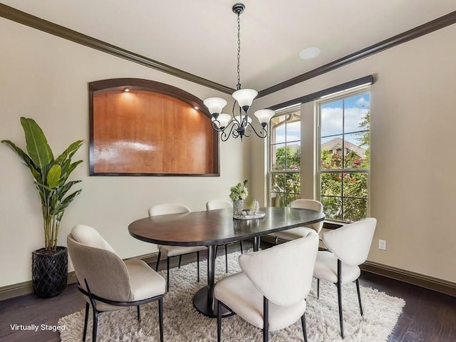 6120 Gunnison Turn Rd, Austin, TX 78738 - dining space featuring a chandelier, wood finished floors, ornamental molding, and baseboards