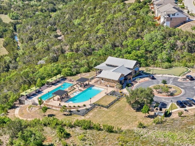 6120 Gunnison Turn Rd, Austin, TX 78738 - drone / aerial view of a pool area and a heavily wooded area