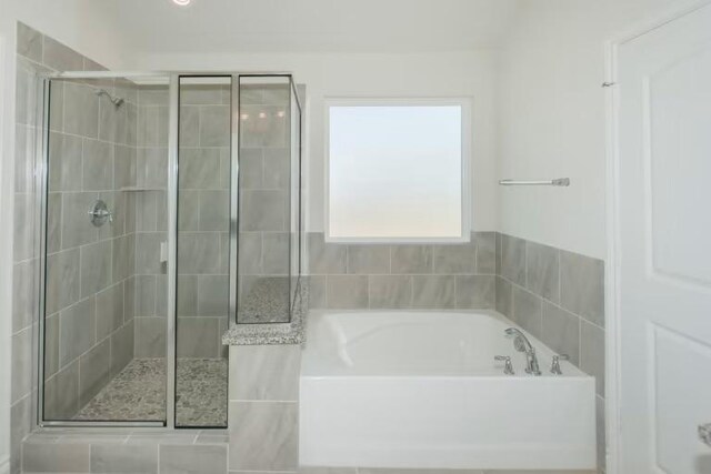 313 Singing Dove Way, Liberty Hill, TX 78642 - full bath featuring a bath and a stall shower