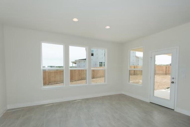313 Singing Dove Way, Liberty Hill, TX 78642 - empty room with recessed lighting, baseboards, and light wood-style flooring